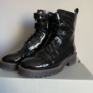 Patent leather ankle boots. These are in a size 9 black.